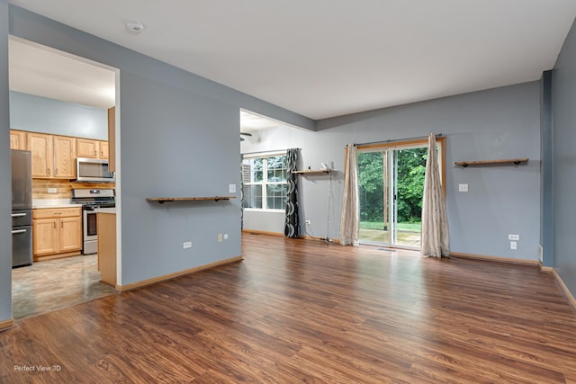 2517 Oak Tree Ln, Plainfield, IL 60586 - unfurnished living room featuring wood finished floors and baseboards