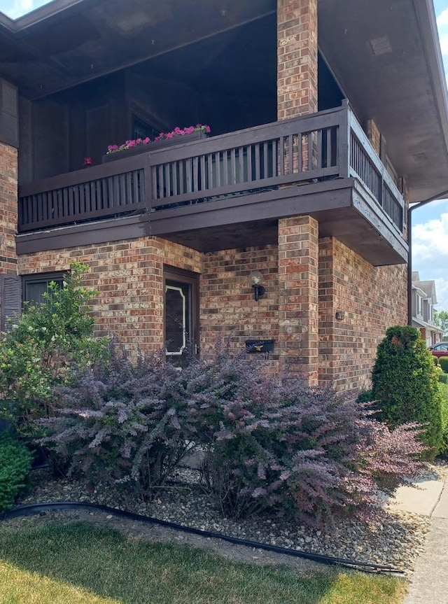 20137 Woodale St Unit 20137, Lynwood, IL 60411 - view of home's exterior with a balcony and brick siding