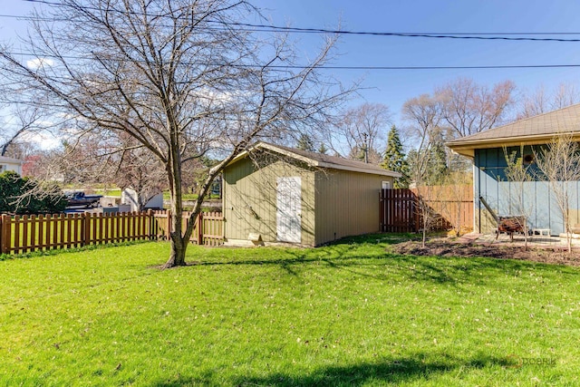 23W073 Dickens Ave, Glen Ellyn, IL 60137 - fenced backyard featuring a storage unit