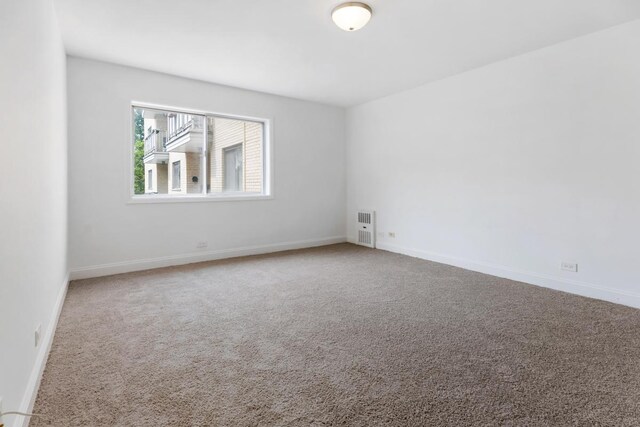 5251 W Galitz St Unit 311, Skokie, IL 60077 - empty room with carpet and baseboards