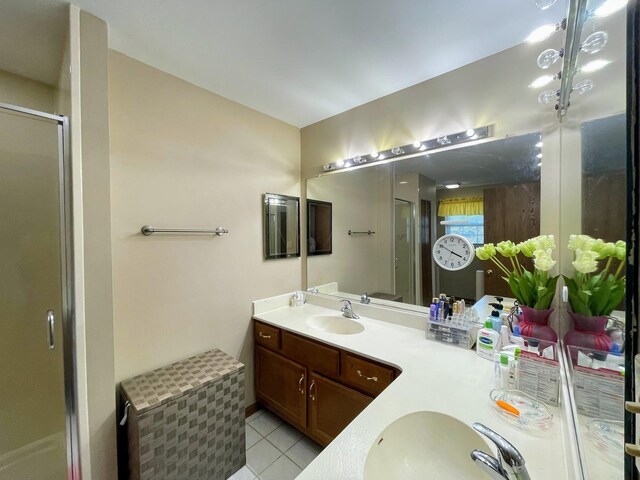 510 Orchards Pass, Bartlett, IL 60103 - bathroom featuring double vanity, a stall shower, and tile patterned floors