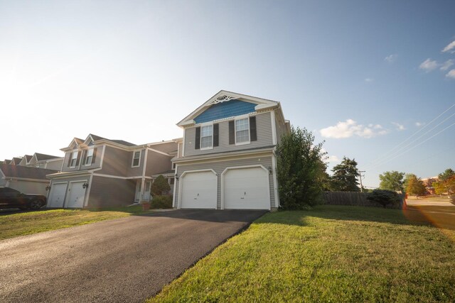 510 Orchards Pass, Bartlett, IL 60103 - view of front of home with an attached garage, asphalt driveway, and a front lawn