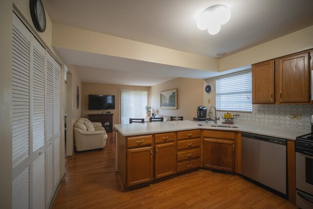 510 Orchards Pass, Bartlett, IL 60103 - kitchen featuring appliances with stainless steel finishes, a peninsula, light countertops, and brown cabinets
