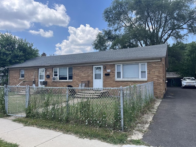 404-408 N Farnsworth Ave, Aurora, IL 60505 - view of front of property featuring brick siding, a fenced front yard, and roof with shingles