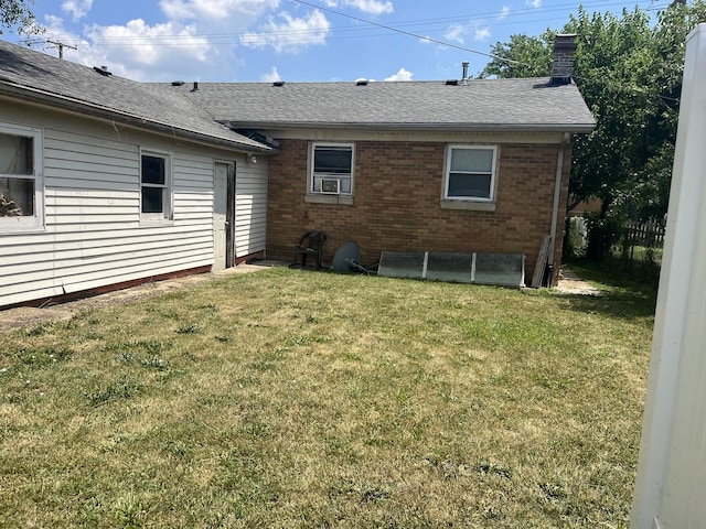 404-408 N Farnsworth Ave, Aurora, IL 60505 - back of property with brick siding, a chimney, and a shingled roof