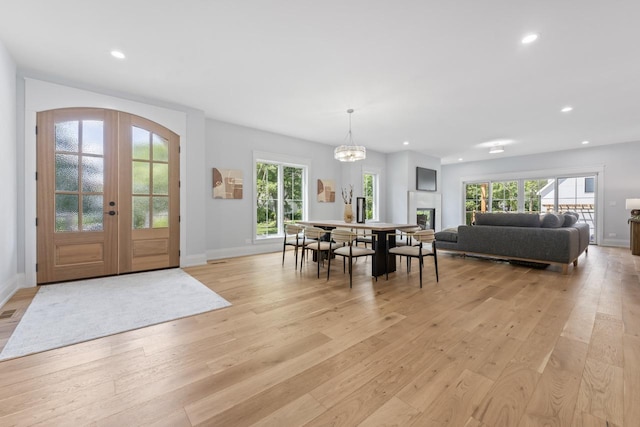 1100 Washington St, Glenview, IL 60025 - dining space with light wood finished floors, plenty of natural light, french doors, and recessed lighting