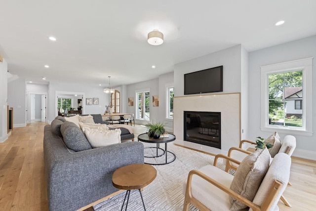 1100 Washington St, Glenview, IL 60025 - living room with plenty of natural light, light wood-type flooring, recessed lighting, and a high end fireplace