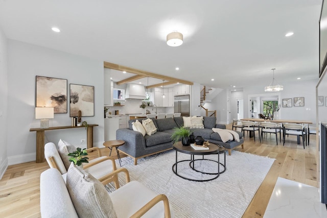 1100 Washington St, Glenview, IL 60025 - living area with stairs, light wood-style flooring, recessed lighting, and a chandelier