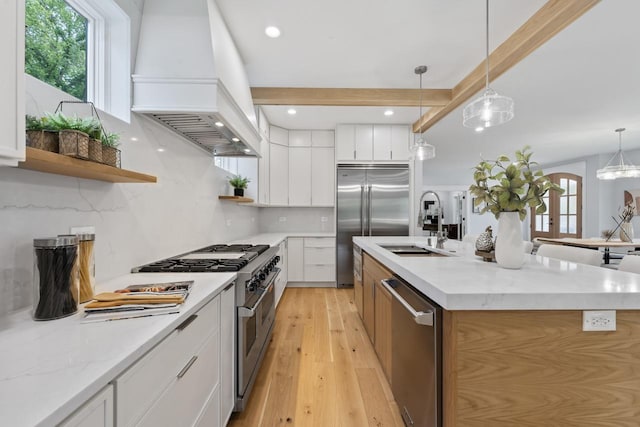1100 Washington St, Glenview, IL 60025 - kitchen with premium appliances, custom exhaust hood, open shelves, light wood-type flooring, and white cabinets
