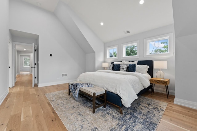1100 Washington St, Glenview, IL 60025 - bedroom featuring lofted ceiling, multiple windows, light wood-style flooring, and recessed lighting