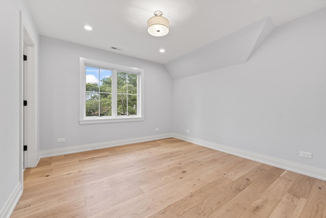 1100 Washington St, Glenview, IL 60025 - spare room with light wood finished floors, recessed lighting, and lofted ceiling