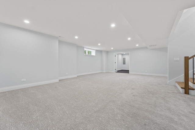 1100 Washington St, Glenview, IL 60025 - below grade area featuring stairs, recessed lighting, and light carpet