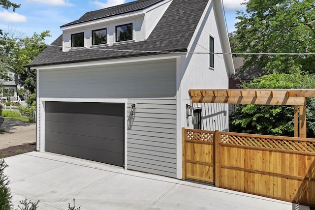 1100 Washington St, Glenview, IL 60025 - view of front of house featuring driveway, a shingled roof, and a garage