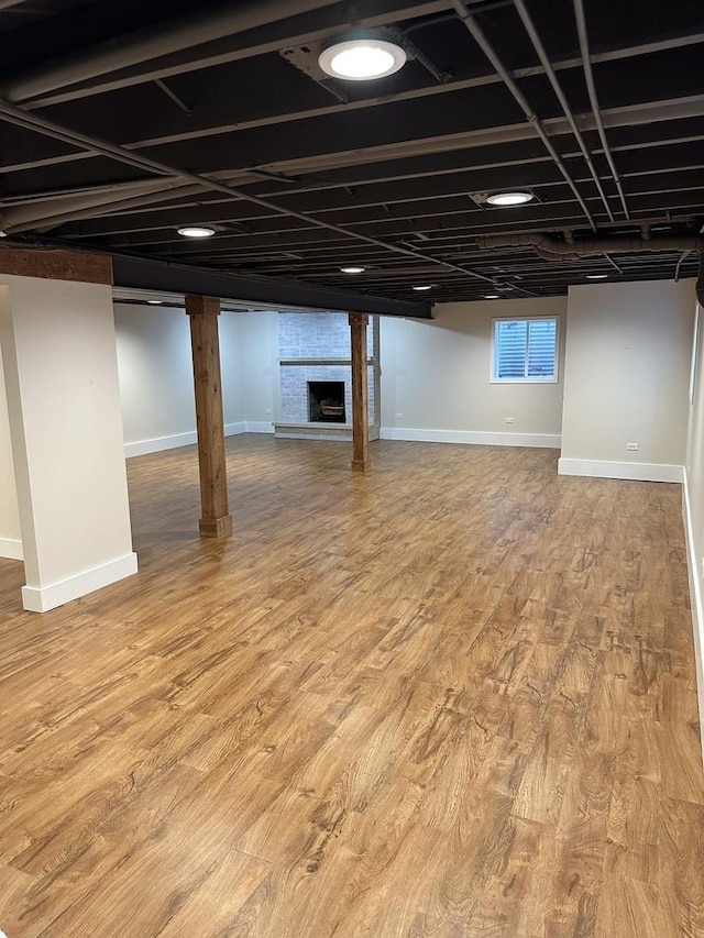 1691 Bilter Rd, Aurora, IL 60502 - finished basement with a fireplace and wood finished floors