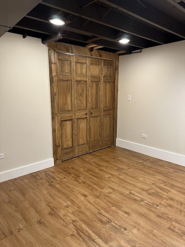 1691 Bilter Rd, Aurora, IL 60502 - finished below grade area with baseboards and light wood-style floors
