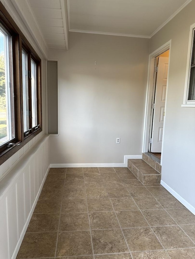 1691 Bilter Rd, Aurora, IL 60502 - tiled empty room featuring plenty of natural light and ornamental molding