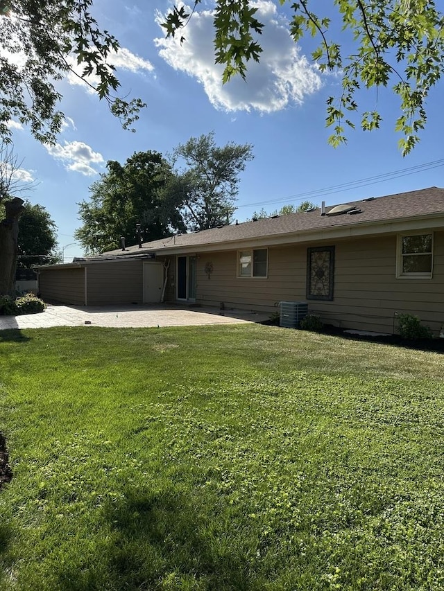 1691 Bilter Rd, Aurora, IL 60502 - rear view of property featuring a patio area and a lawn