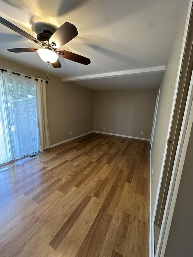 1691 Bilter Rd, Aurora, IL 60502 - empty room with ceiling fan and wood finished floors