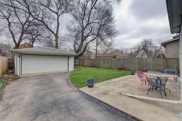 1825 S 8th Ave, Maywood, IL 60153 - view of patio with an outdoor structure and a detached garage