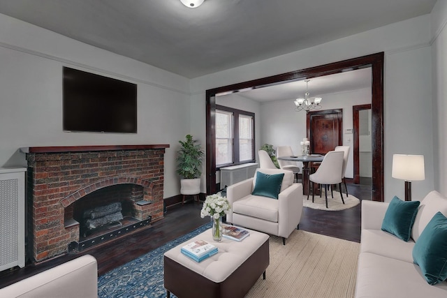 1825 S 8th Ave, Maywood, IL 60153 - living area with wood finished floors, a chandelier, and a brick fireplace