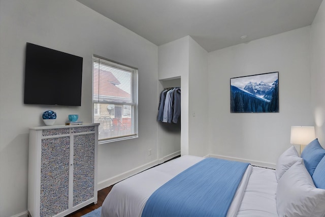 1825 S 8th Ave, Maywood, IL 60153 - bedroom with baseboards and dark wood finished floors