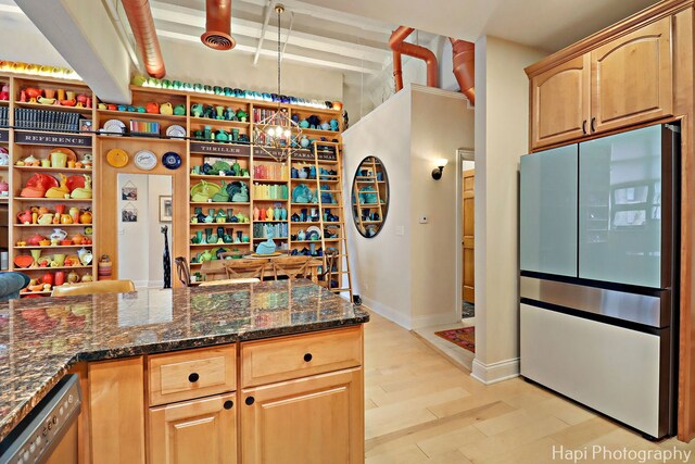 110 N 2nd St Unit 4, West Dundee, IL 60118 - kitchen featuring freestanding refrigerator, dark stone counters, dishwasher, light wood-type flooring, and a chandelier