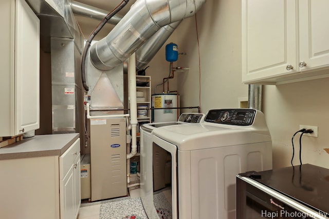 110 N 2nd St Unit 4, West Dundee, IL 60118 - laundry room with cabinet space, washing machine and clothes dryer, water heater, and light tile patterned floors