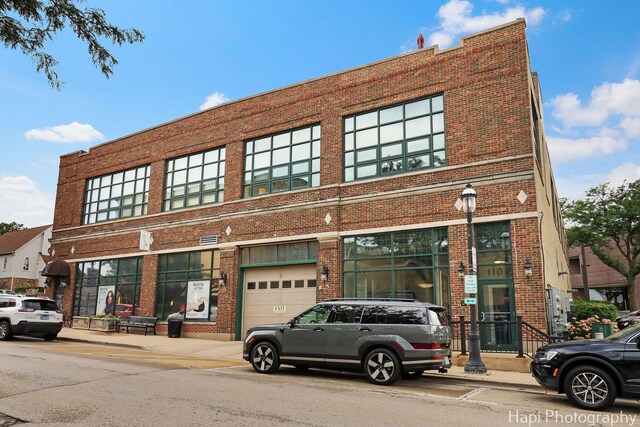 110 N 2nd St Unit 4, West Dundee, IL 60118 - view of building exterior with a garage