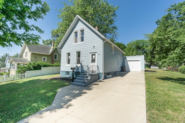 328 Silver St, Elgin, IL 60123 - bungalow-style home with an outbuilding, concrete driveway, and a chimney
