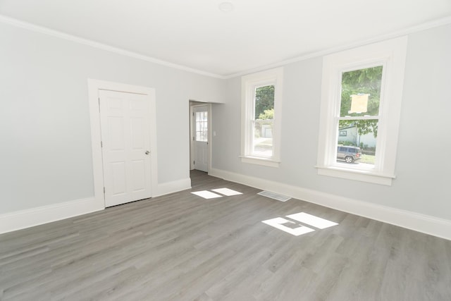 328 Silver St, Elgin, IL 60123 - unfurnished room with crown molding and wood finished floors