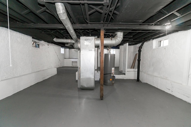 328 Silver St, Elgin, IL 60123 - below grade area with gas water heater, plenty of natural light, and heating unit