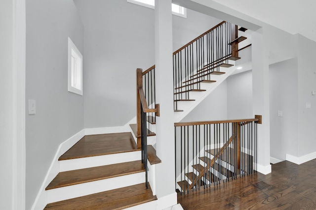2613 Kenilworth Ave, Berwyn, IL 60402 - staircase with wood finished floors and a towering ceiling