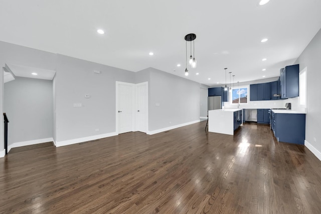 2613 Kenilworth Ave, Berwyn, IL 60402 - unfurnished living room with dark wood-type flooring and recessed lighting