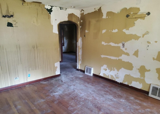 15734 Marshfield Ave, Harvey, IL 60426 - unfurnished room featuring arched walkways and baseboards