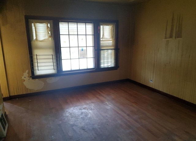 15734 Marshfield Ave, Harvey, IL 60426 - empty room with wood finished floors and baseboards