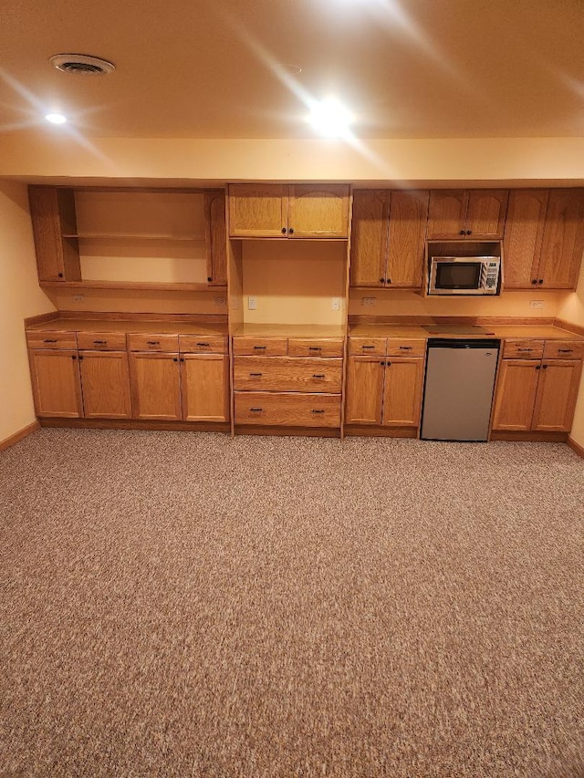 247 Lillian Ct, Geneva, IL 60134 - kitchen featuring dishwashing machine, stainless steel microwave, brown cabinets, and open shelves