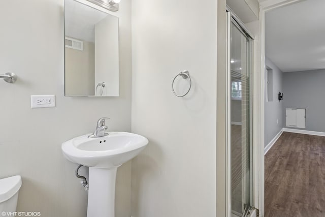 5051 Wright Ter, Skokie, IL 60077 - full bath with an enclosed shower and wood finished floors
