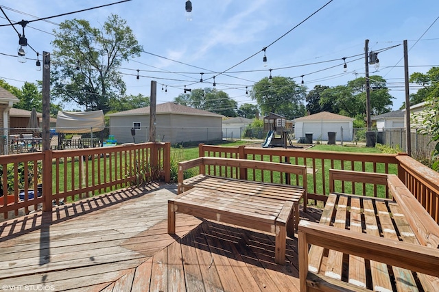 5051 Wright Ter, Skokie, IL 60077 - wooden deck featuring a playground and a fenced backyard