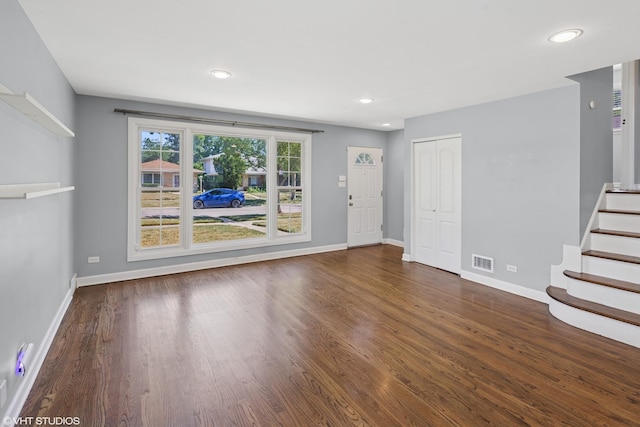 5051 Wright Ter, Skokie, IL 60077 - unfurnished living room with recessed lighting, wood finished floors, and stairway