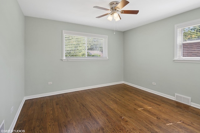 5051 Wright Ter, Skokie, IL 60077 - spare room featuring dark wood-style floors and a ceiling fan