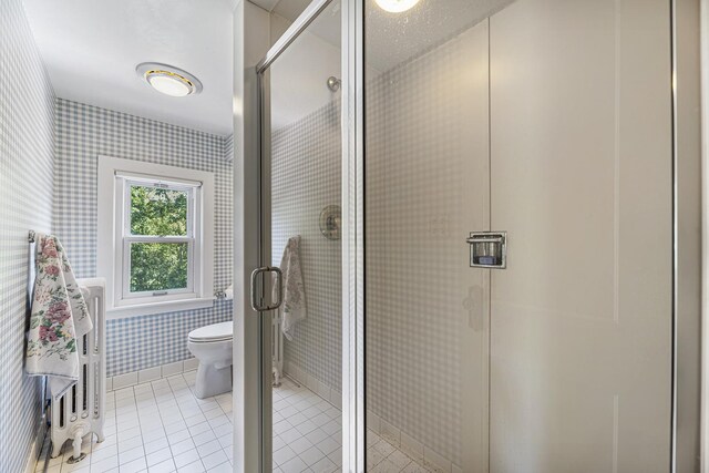 1755 Sunset Ln, Bannockburn, IL 60015 - bathroom with wallpapered walls, a shower stall, and tile patterned flooring