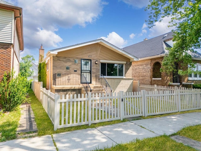 422 W 98th Pl, Chicago, IL 60628 - view of front of house with brick siding and a fenced front yard