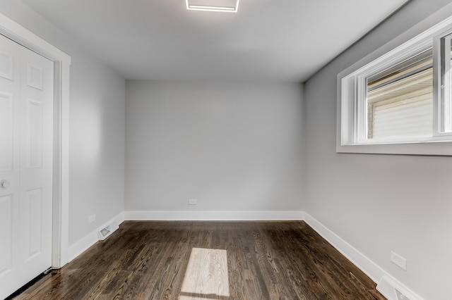 422 W 98th Pl, Chicago, IL 60628 - empty room featuring dark wood finished floors and baseboards