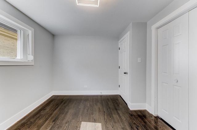 422 W 98th Pl, Chicago, IL 60628 - empty room with dark wood finished floors and baseboards