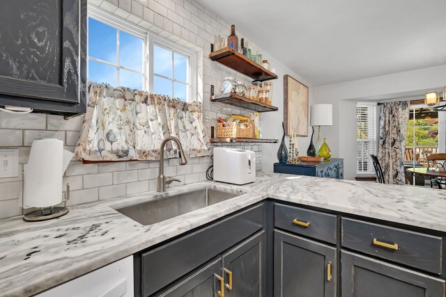 2570 Cobblestone Ct, Morris, IL 60450 - kitchen with backsplash, open shelves, gray cabinetry, and light stone countertops