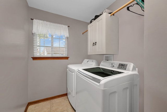 2570 Cobblestone Ct, Morris, IL 60450 - washroom featuring independent washer and dryer, cabinet space, and light tile patterned floors
