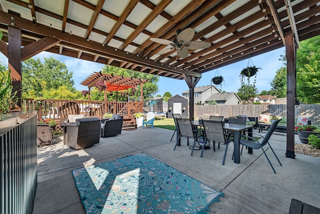 2570 Cobblestone Ct, Morris, IL 60450 - fenced backyard featuring outdoor dining area, a storage shed, a ceiling fan, a patio area, and a pergola