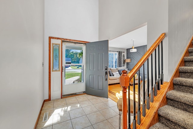 2570 Cobblestone Ct, Morris, IL 60450 - entrance foyer featuring a high ceiling, stairway, and light tile patterned floors