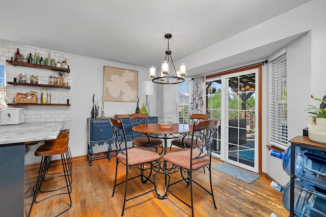 2570 Cobblestone Ct, Morris, IL 60450 - dining room with light wood finished floors and a chandelier
