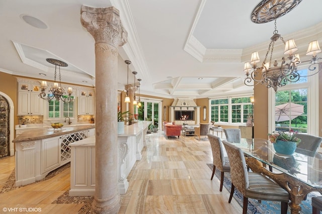 1031 Barrys Ct, Lake Forest, IL 60045 - dining room featuring a chandelier, crown molding, ornate columns, and a raised ceiling